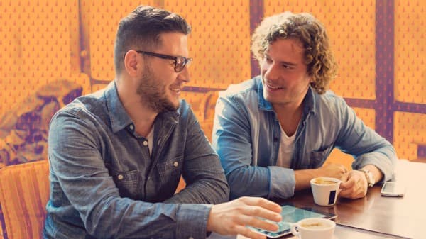 two guys getting coffee