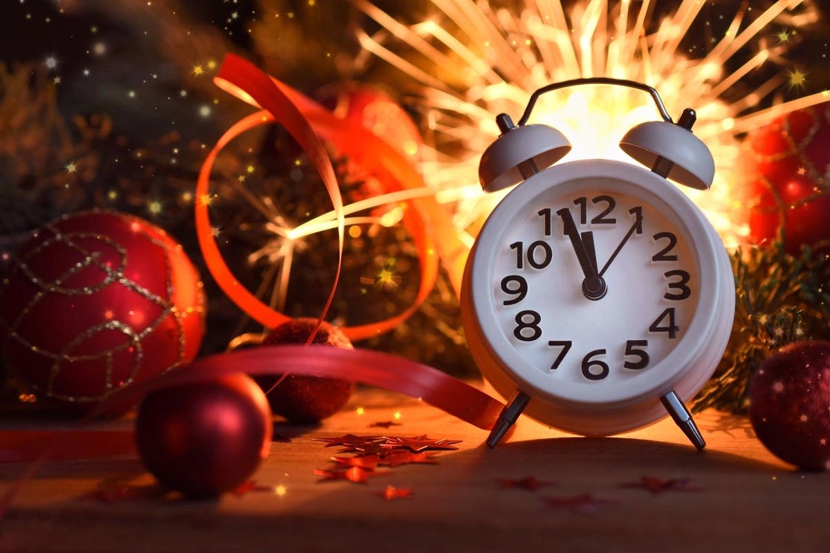 alarm clock with firework and streamers behind it