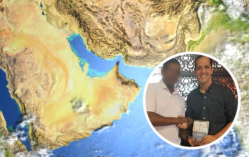 two people with Xplore over a map of Saudi Arabia